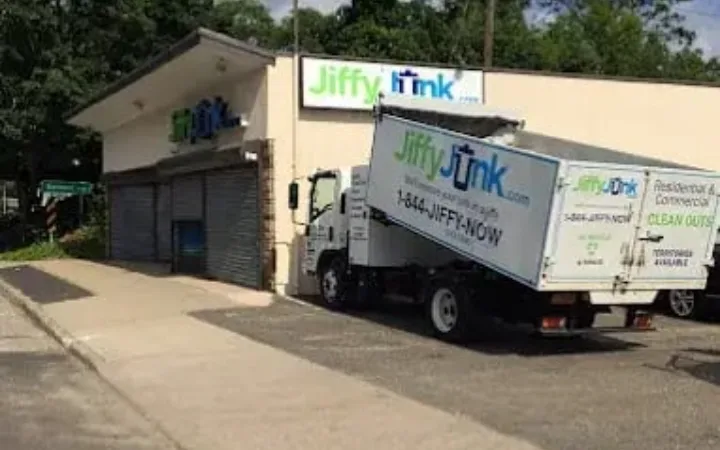 Jiffy Junk truck hauling storm debris in Kansas City
